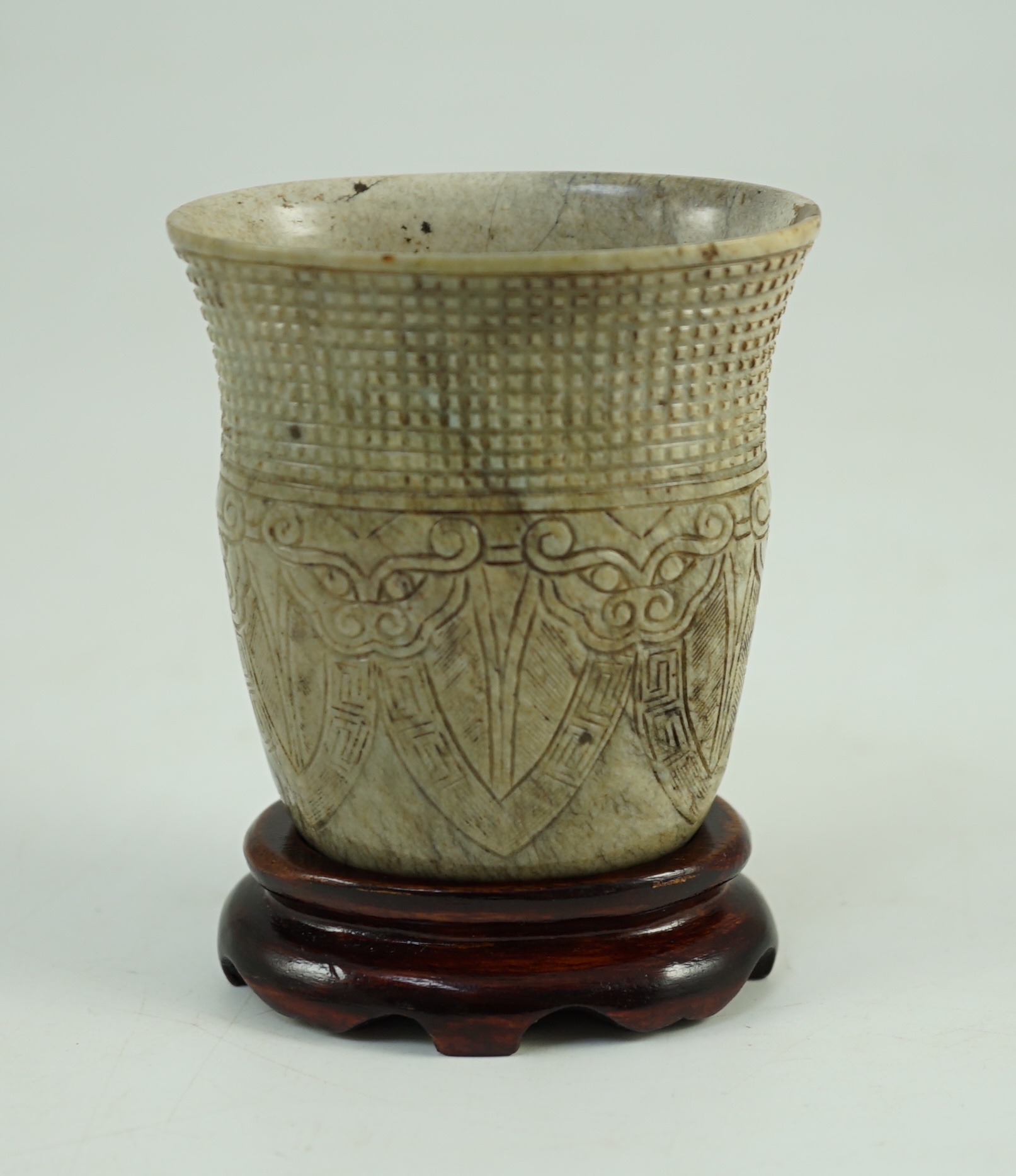 A Chinese archaistic burnt ‘chicken bone’ jade oval cup, chan, probably Song dynasty, 7.1 cm high, small chip repair